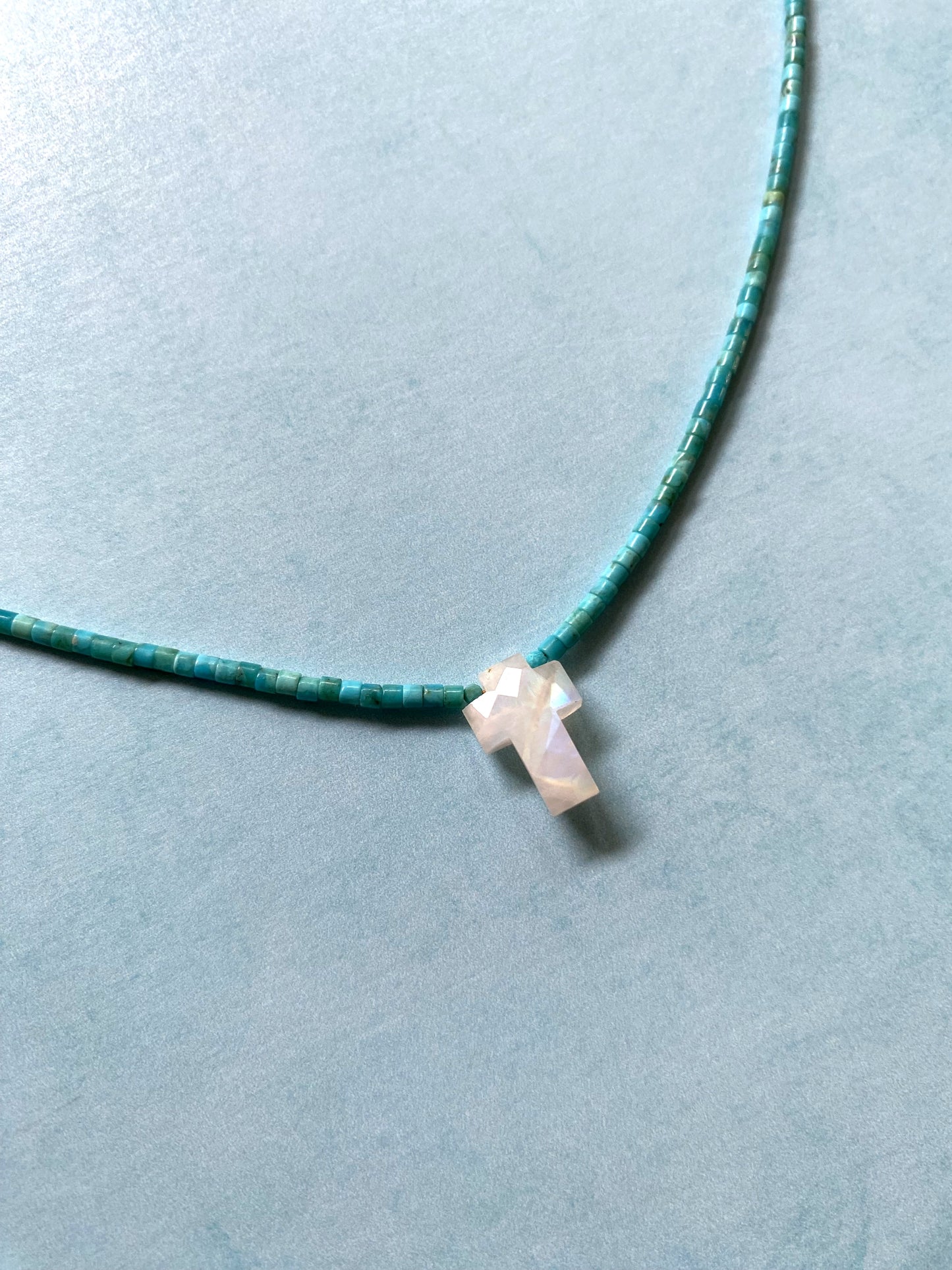 KEEP SHINING CROSS NECKLACE IN TURQUOISE AND RAINBOW MOONSTONE