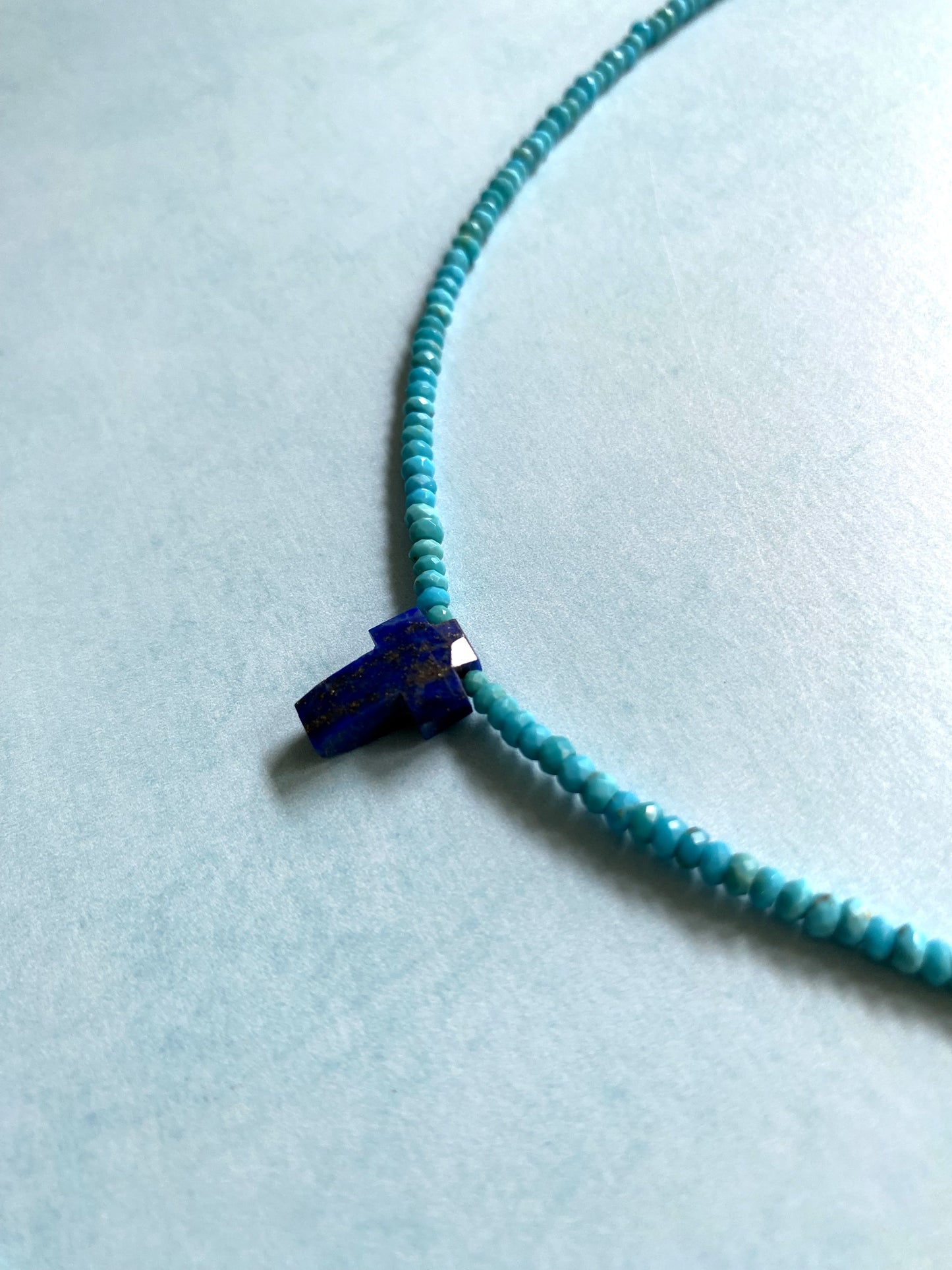 INNER STRENGTH CROSS NECKLACE IN TURQUOISE AND LAPIS